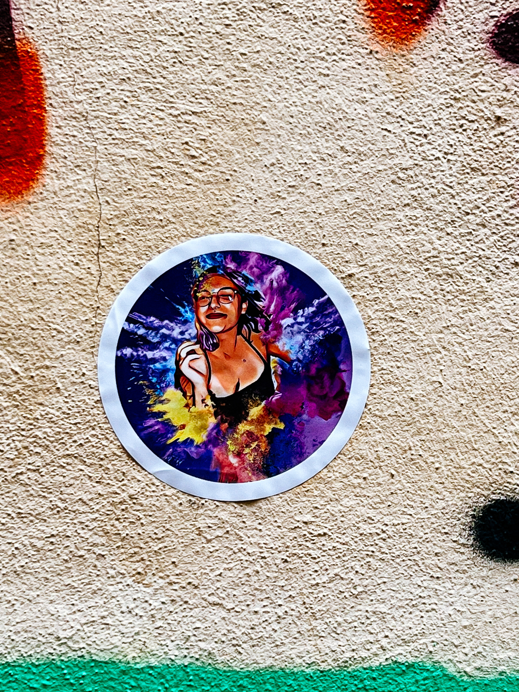 Sticker with the photo of a laughing girl. 