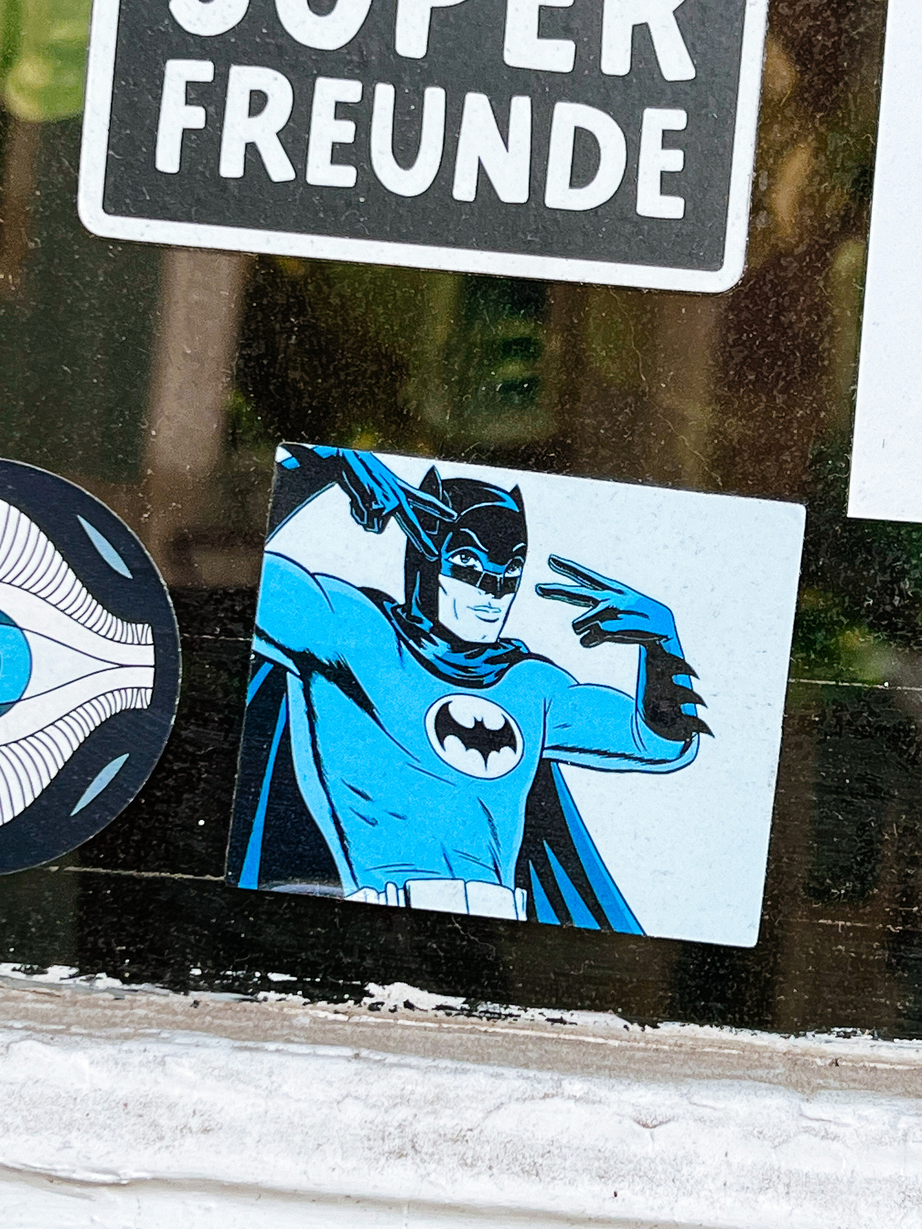 Sticker with Batman flashing two “V” with his hands. 