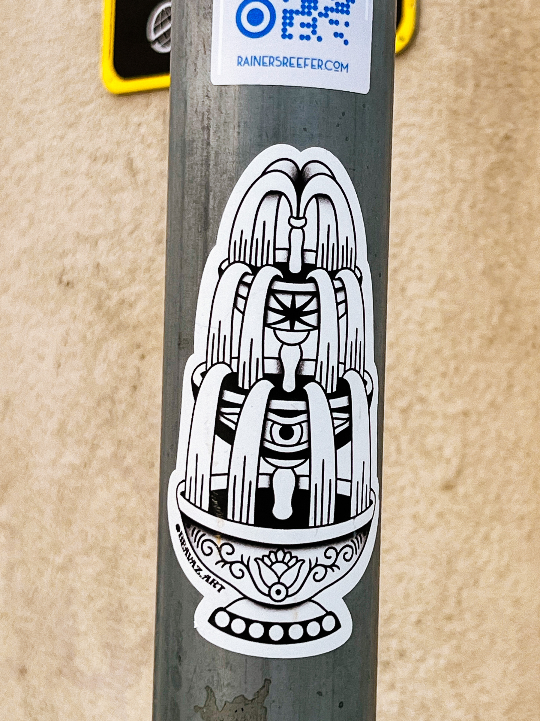 Sticker with a tattoo style design of a fountain. 
