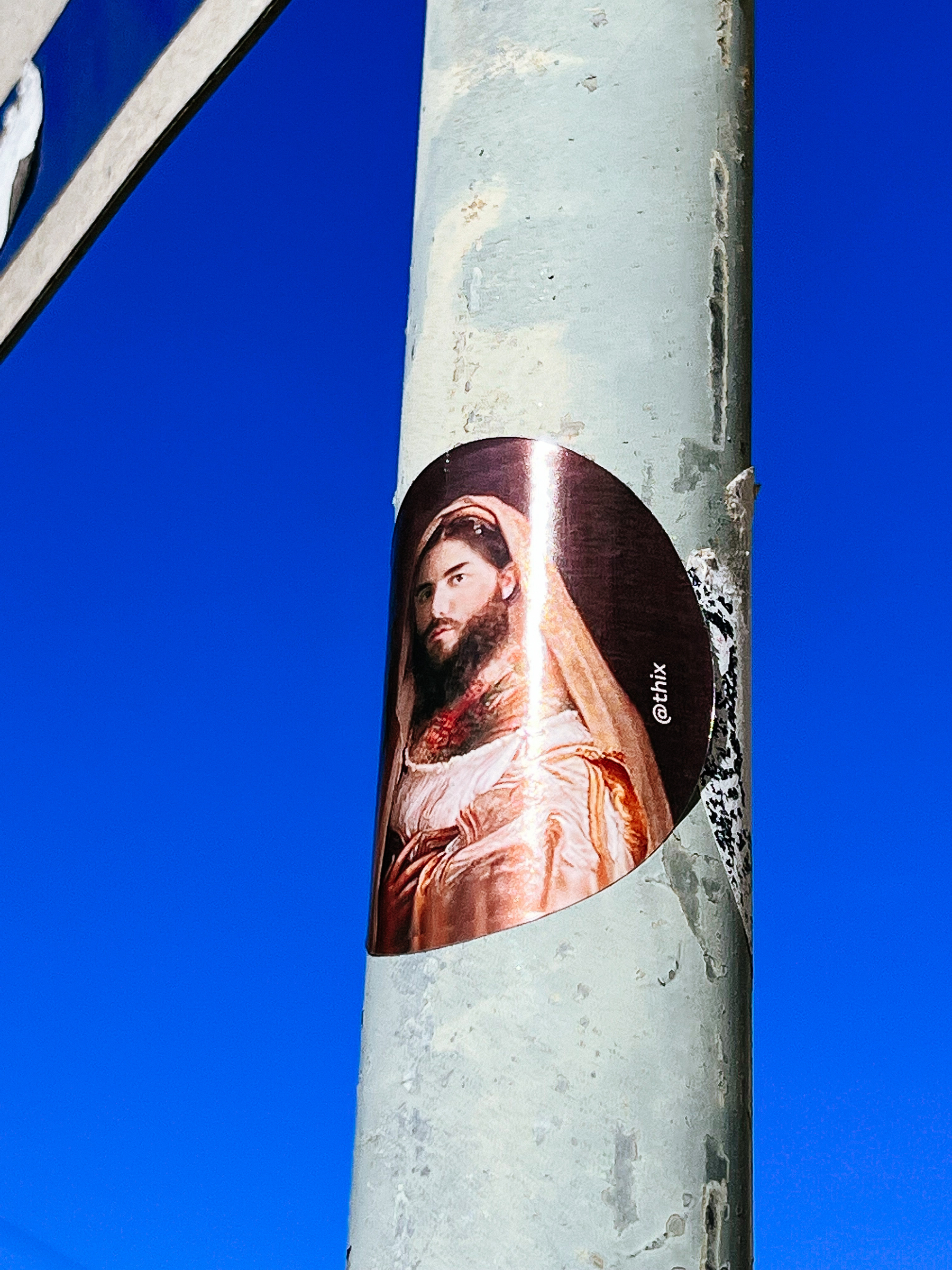 Sticker with a photo of a bearded Holy Mary. 