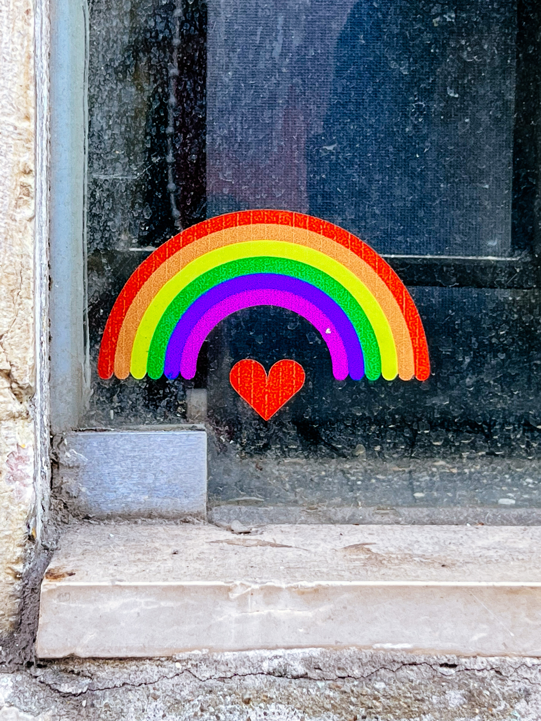 Sticker with a rainbow, and a heart. 
