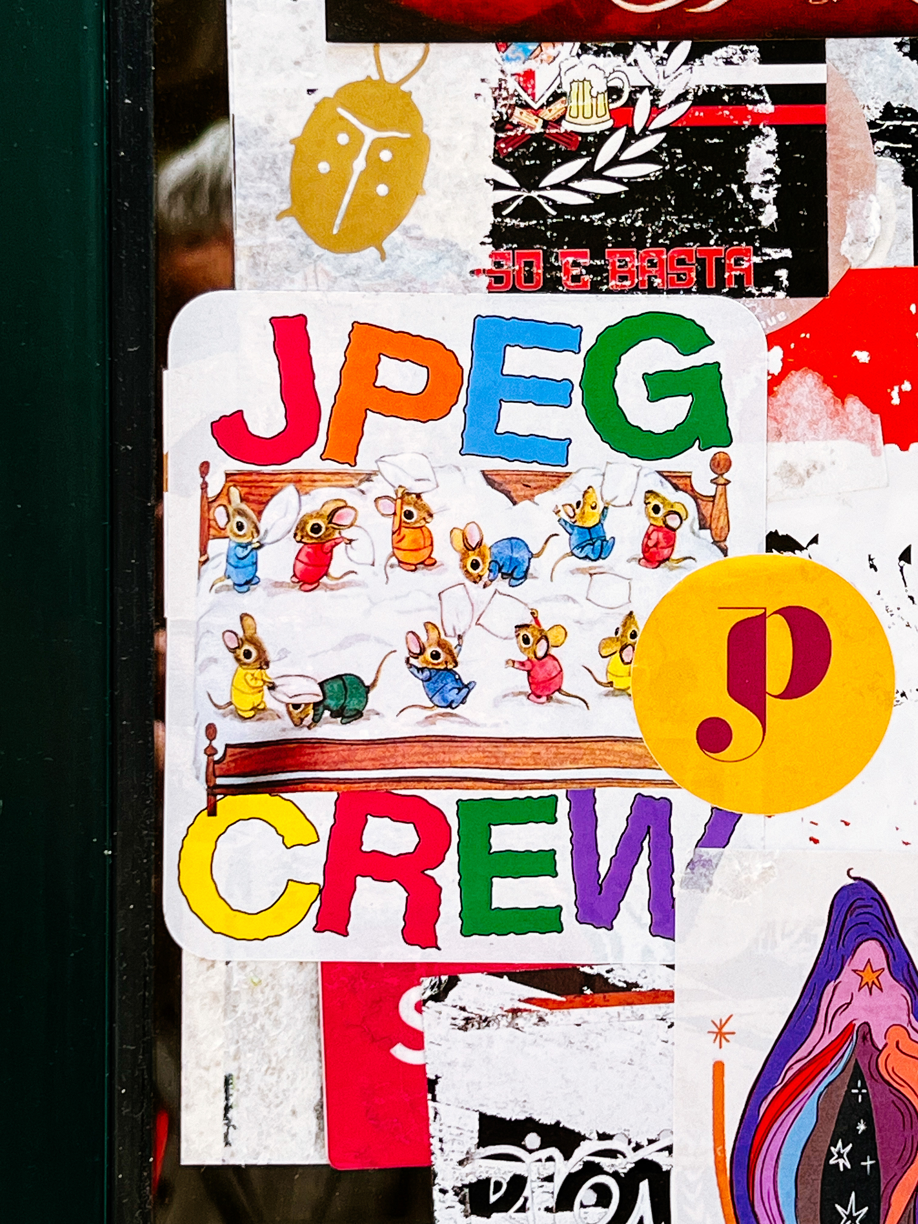 Sticker with a lot of tiny mice, and the words “JPEG CREW”. 