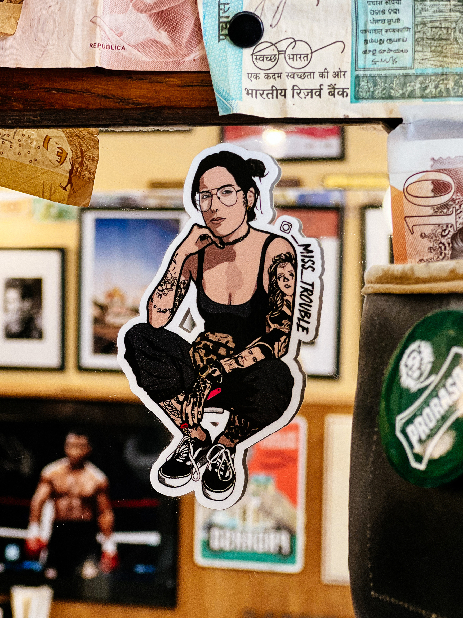 Sticker with a drawing of a tattooed girl. 