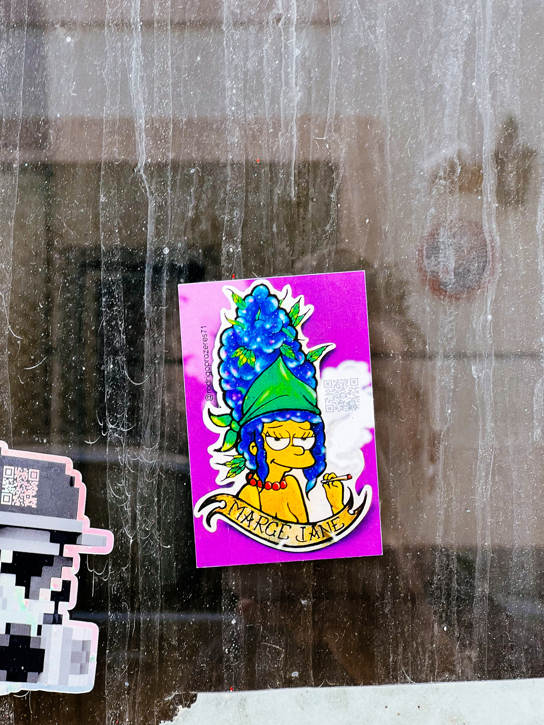 Marge, from The Simpsons, smoking a joint. Weed leaves coming out of her air. ”Marge Jane”. Sticker. 