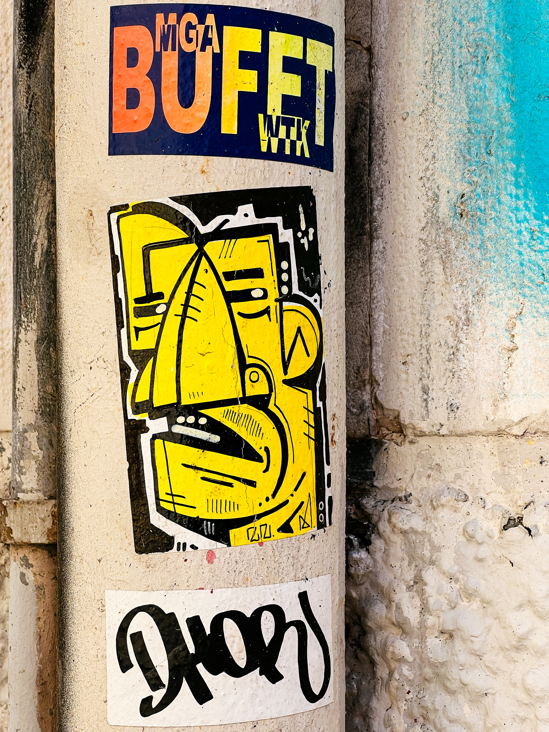 “Cubist” style yellow face. A sticker. 