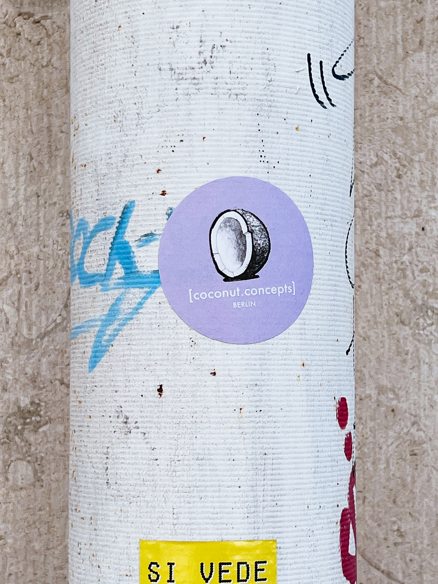 “Coconut Concepts - Berlin”, and half a coconut. A sticker. 