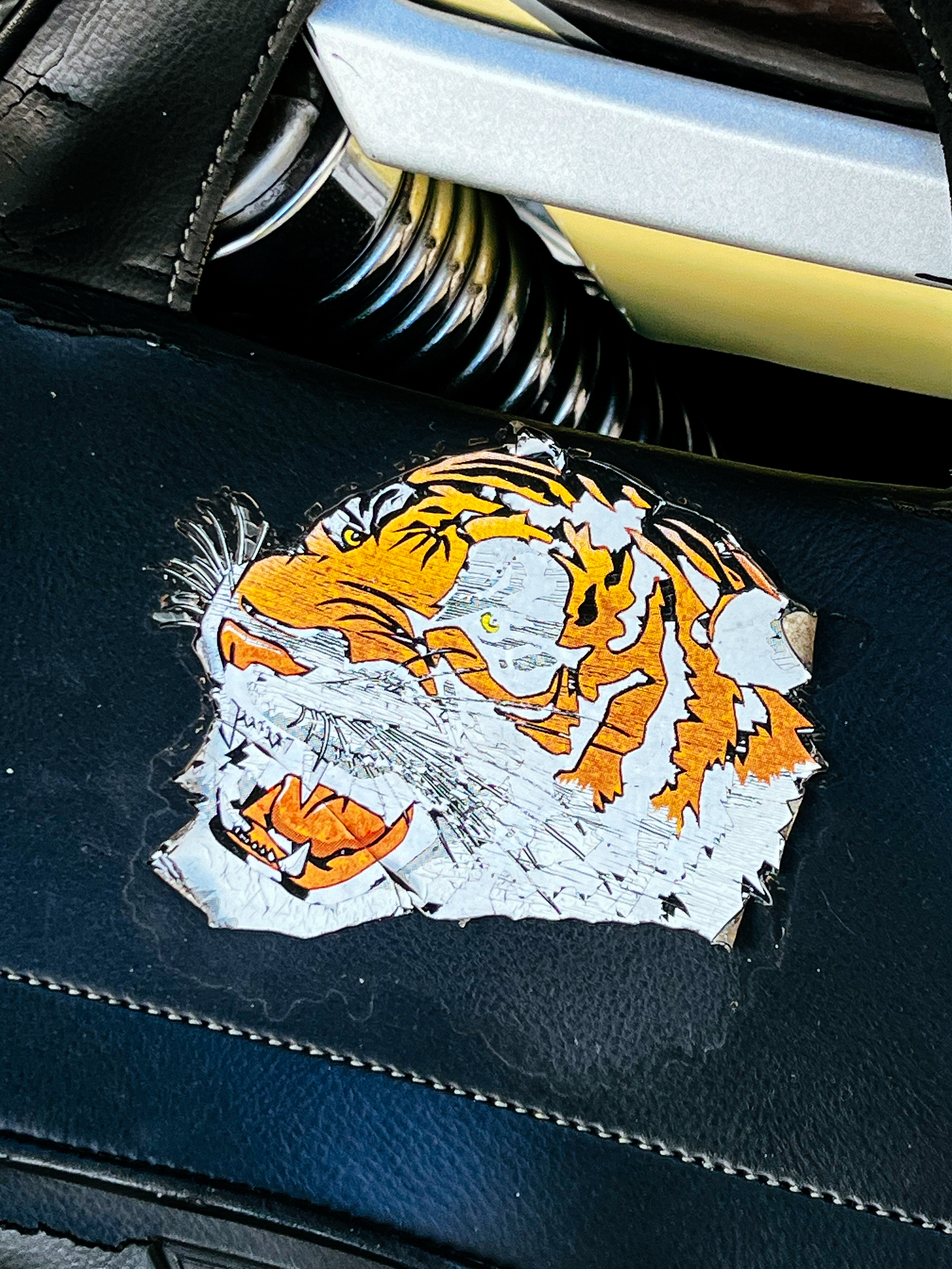 A tiger sticker on a motorcycle. 